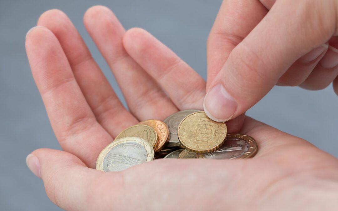 Girl counts coins in hands